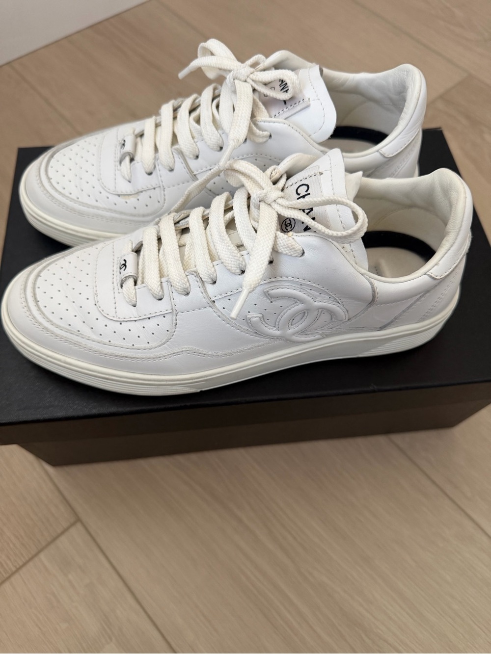 CHANEL White Leather Low-Top Sneakers with Quilted CC Detail